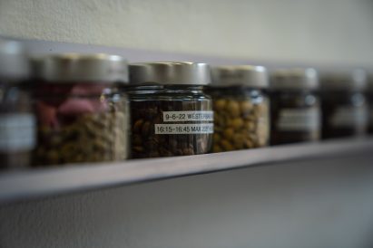 Jars of roasted coffee beans