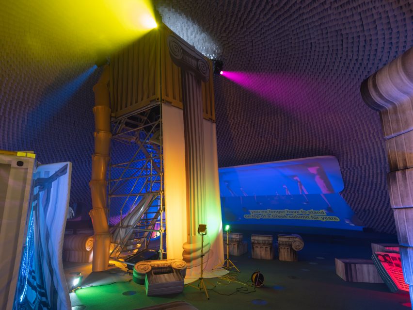 Column made from scaffolding in a colourful room