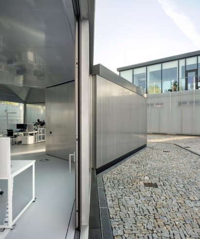 View of Modular Research Centre between a sliding door