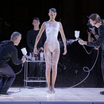 Fabrican is pictured spraying a dress onto a model