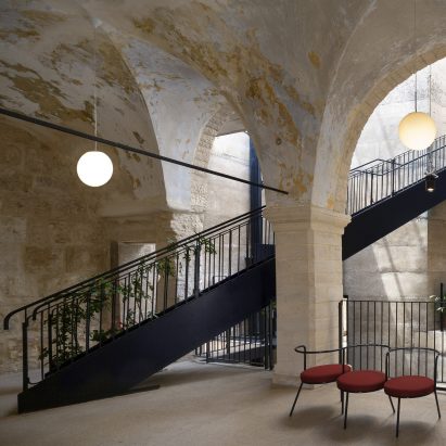 Stone courtyard with red seats