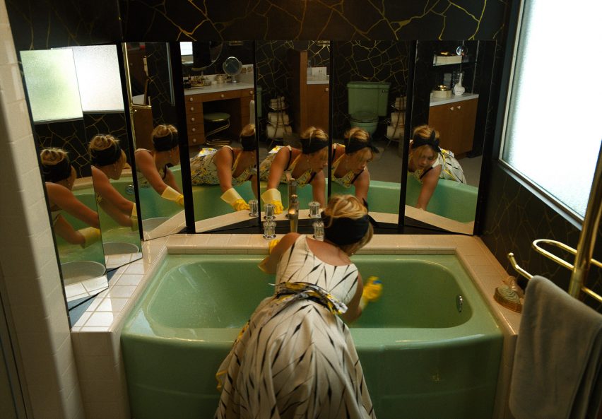 A woman cleaning a bathroom