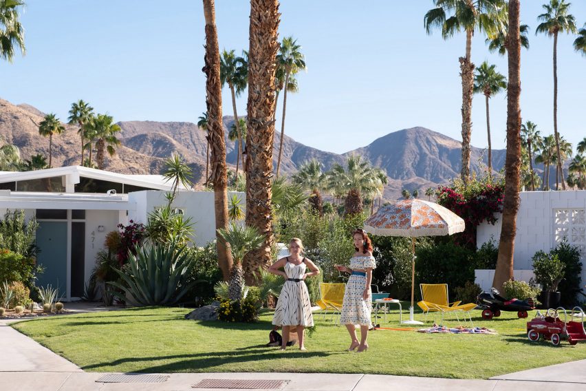 Two characters on a film set on grass lawns
