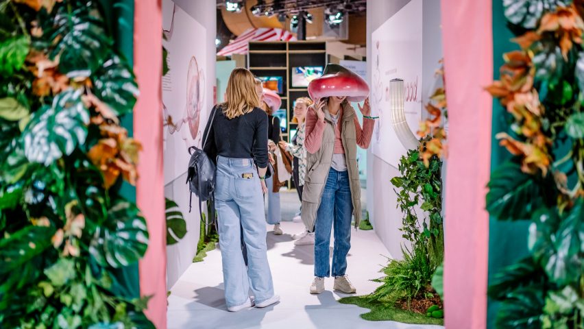 Two visitors browsing exhibitions at Dutch Design Week