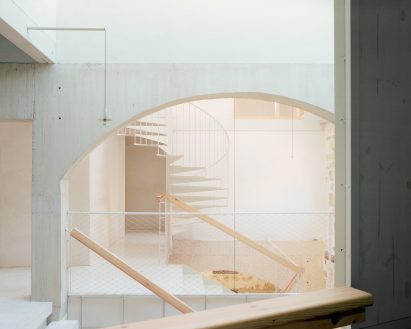 Interior image of the metal and stone staircases at El Priorato