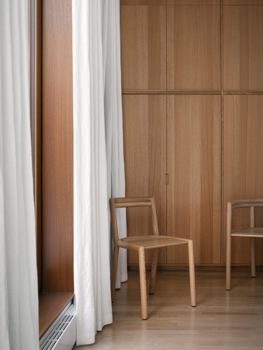 Elsie wooden chair without armrests in a wood panelled room