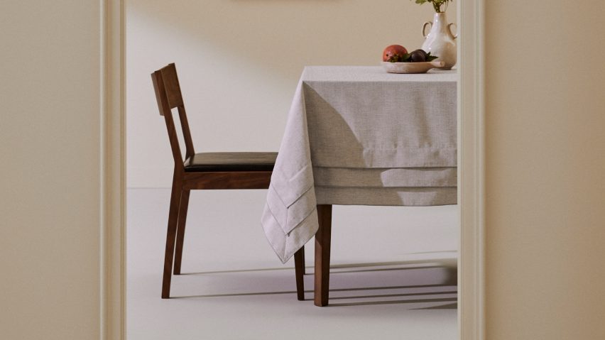 Image through doorway of table with tablecloth draped over