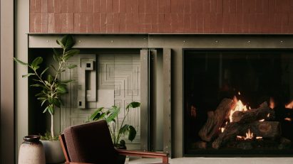 Fireplace flanked by ceramic tiles