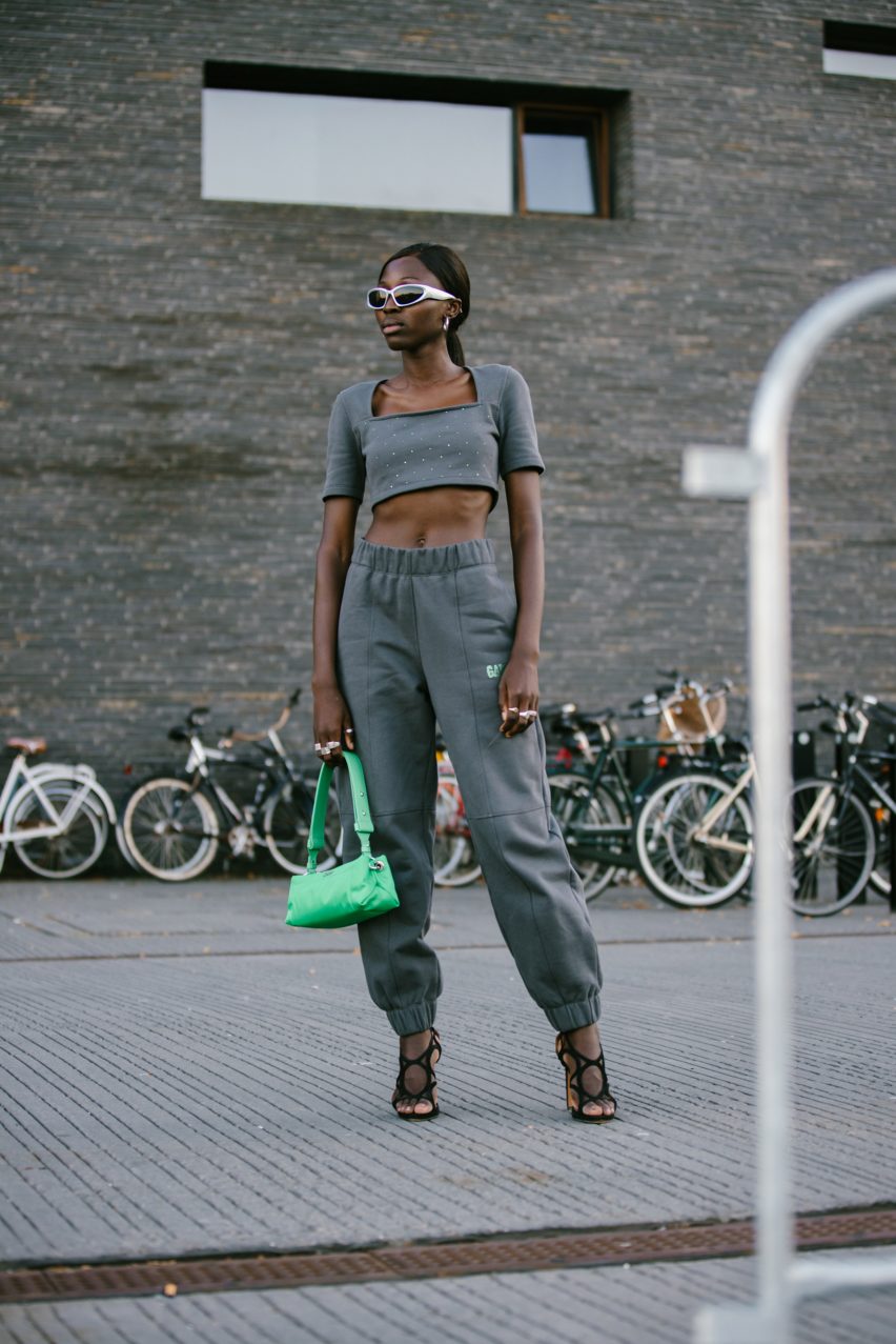 A woman wearing a grey tracksuit by Ganni
