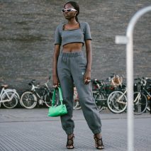 A model wearing a Ganni and Pyratex tracksuit