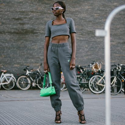 A model wearing a Ganni and Pyratex tracksuit