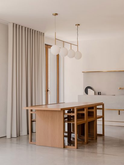 Wooden dining table and matching chairs in The Hideaway Home, Gdańsk