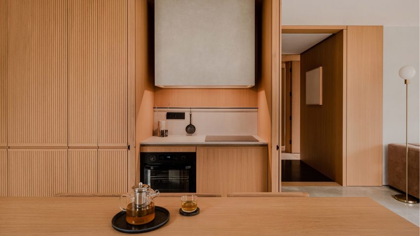 TImber-clad kitchen of The Hideaway Home, Gdańsk, by ACOS