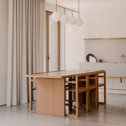 Wooden dining table and matching chairs in The Hideaway Home, Gdańsk, by ACOS