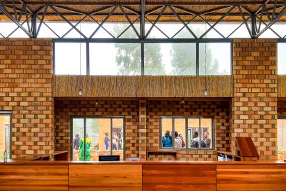 Interior image looking out to the gardens at the Learning + Sports Center