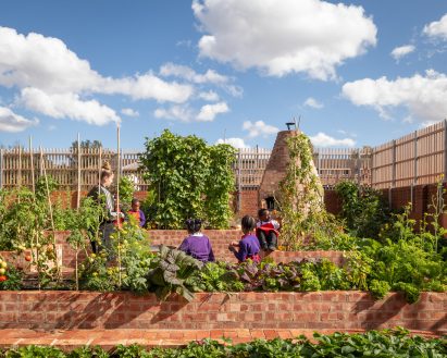 Children learning in gardens of Interior of Hackney School of Food