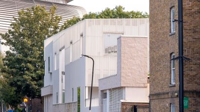 Edith Neville Primary School is a white aluminium mesh-wrapped school