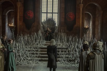 Man standing in front of throne with multiple swords