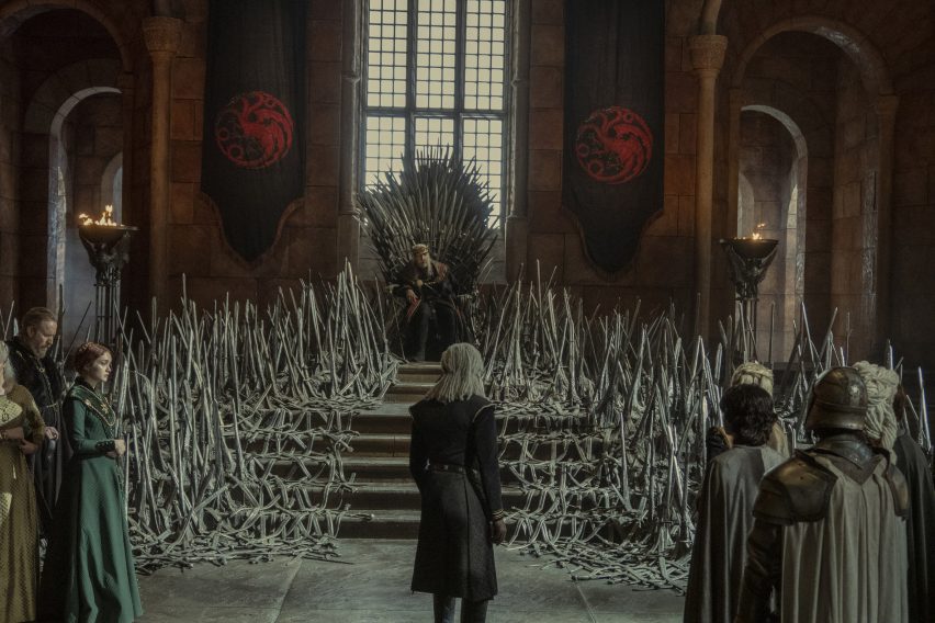 Man standing in front of throne with multiple swords
