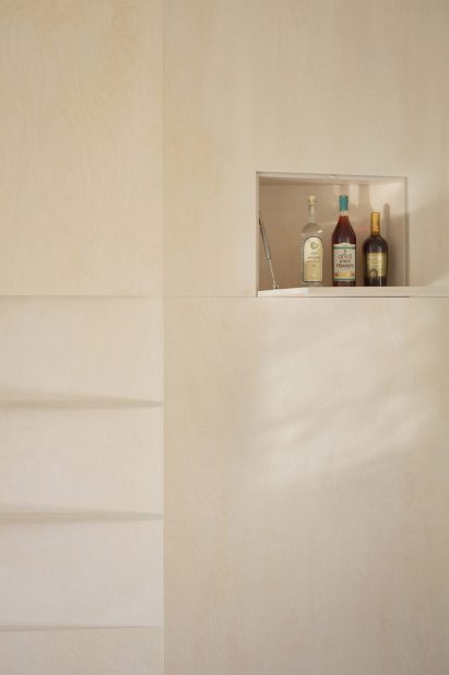 Tel Aviv apartment by Laila Architecture features plywood storage "iceberg"