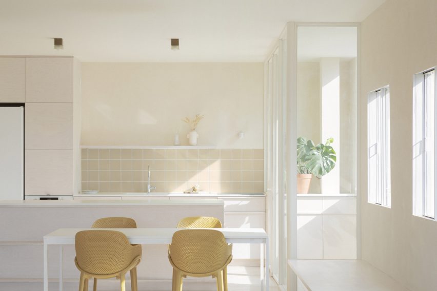 Plywood kitchen inside Iceberg apartment by Laila Architecture