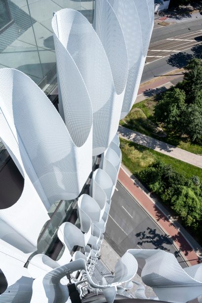 Undulating metal cladding