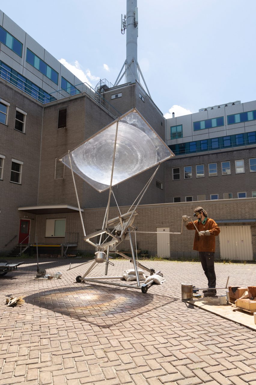 Jelle Seegers turns the crank on the Solar Metal Smelter