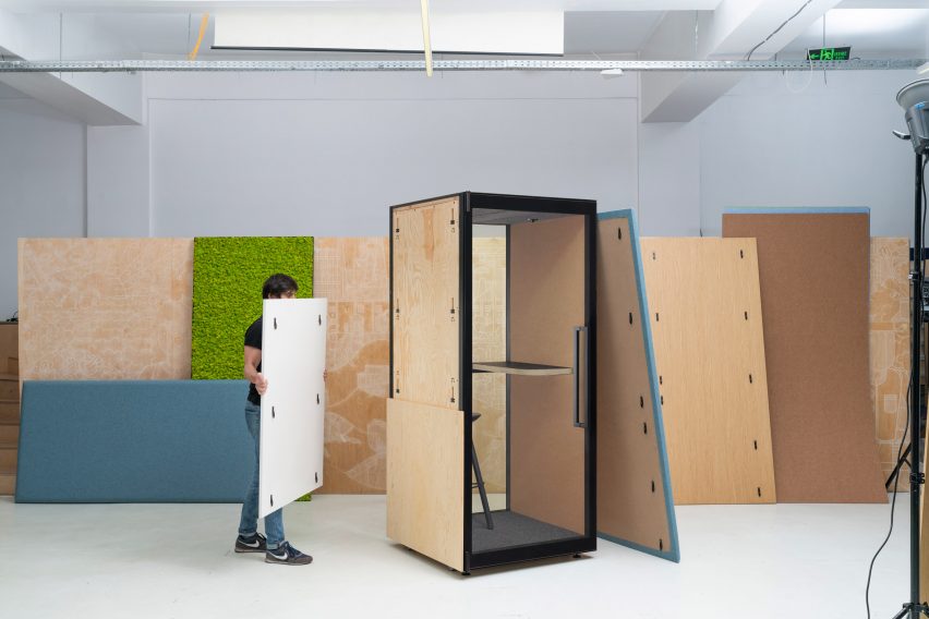 Person assembling a Kameleon Office Booth