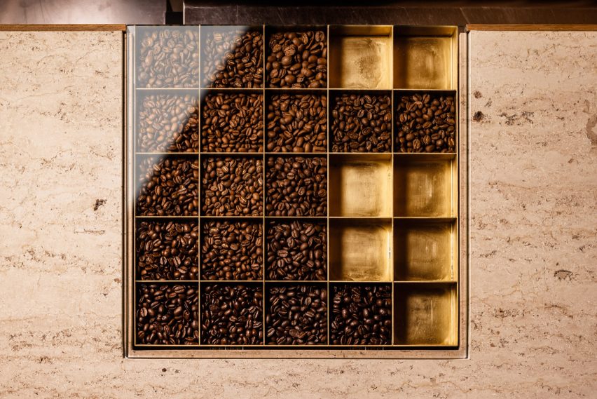 coffee beans stored in display unit inside stone counter top