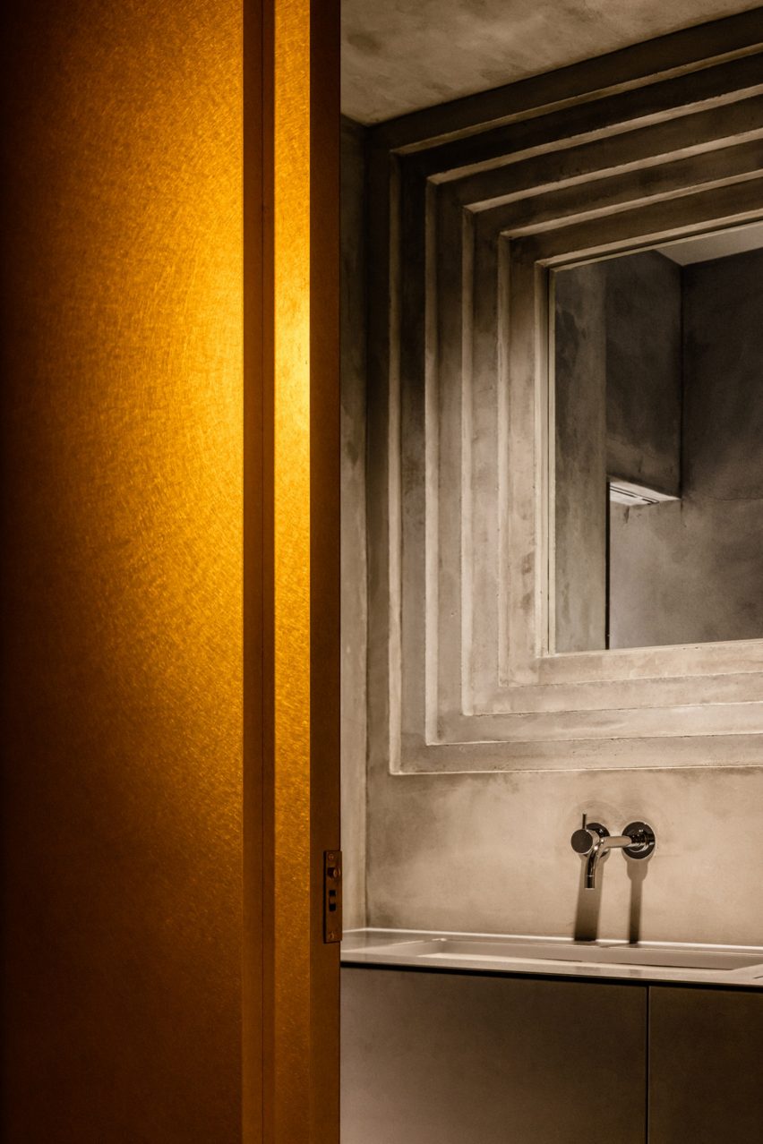 Concrete frame above toilet sink
