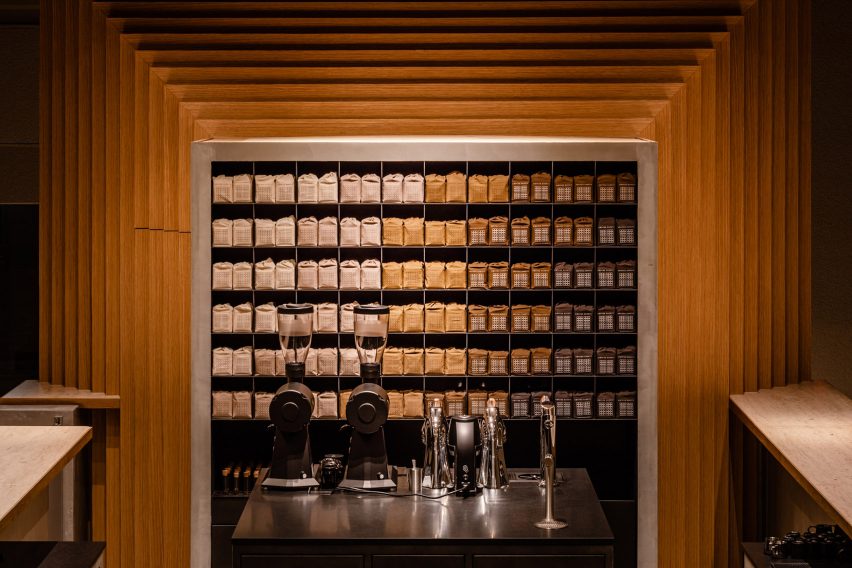 Display unit of coloured coffee bags inside timber frame