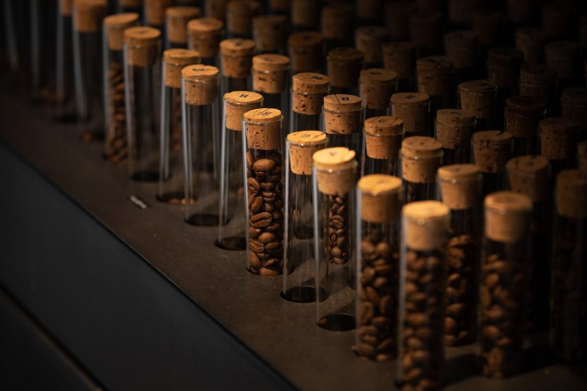 vials of coffee beans in counter holder
