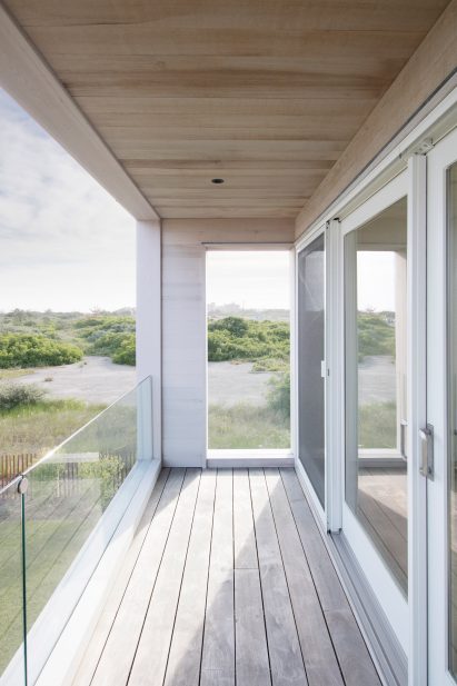 A patio terrace surrounding Lido Beach House 2
