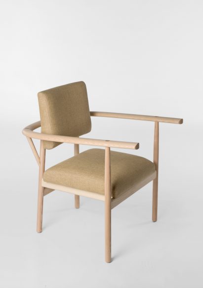 Wooden seat with armrest that wraps around it