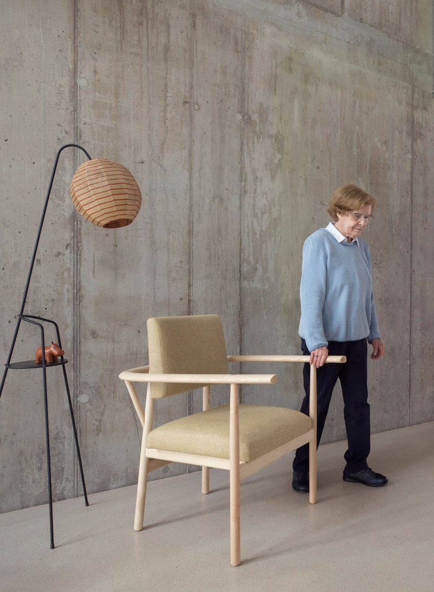 Woman beside Lotte armchair