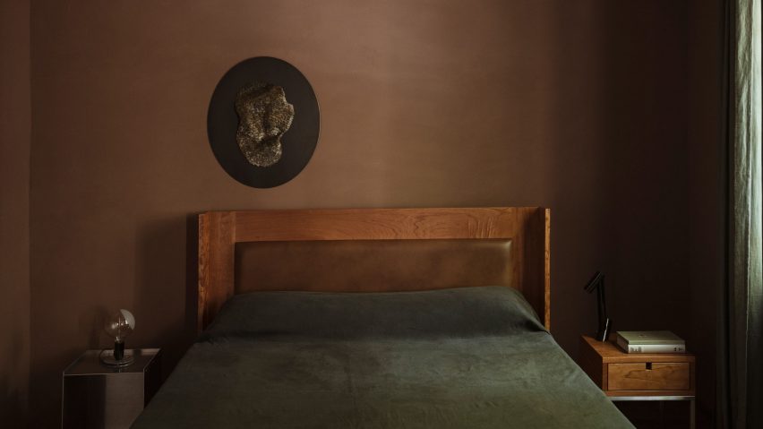 Chocolate brown bedroom with custom leather headboard
