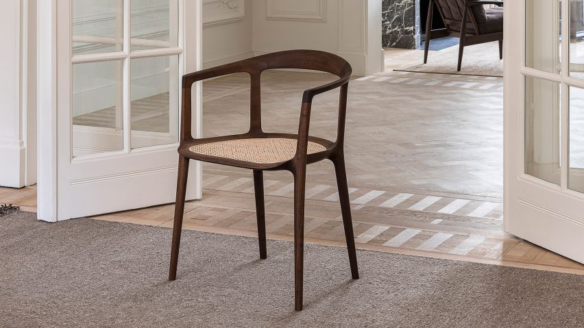 Wooden DC10 chair in a room with white french doors