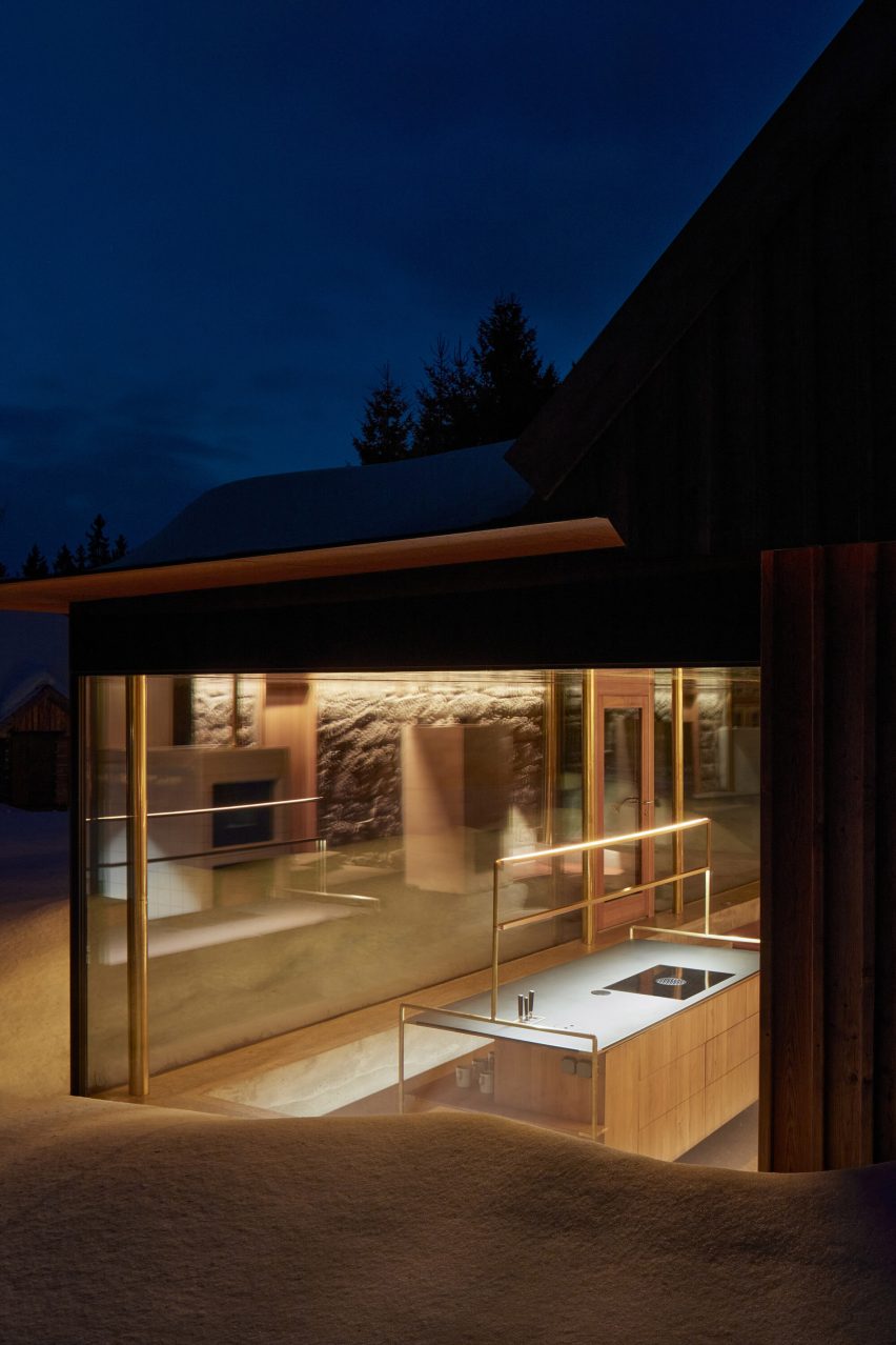 Photograph of cabin in snow