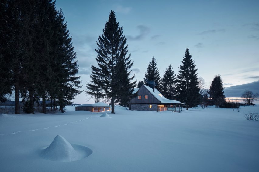 Photograph of cabin in snow