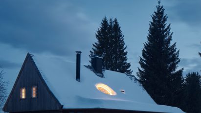 Photograph of cabin in snow