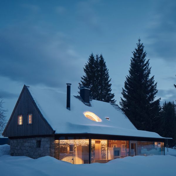 Photograph of cabin in snow