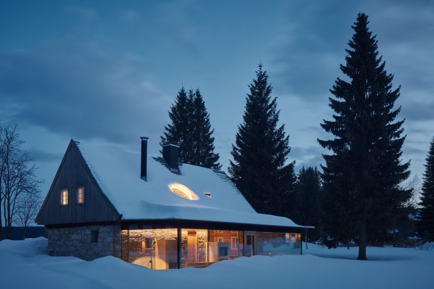 Photograph of cabin in snow