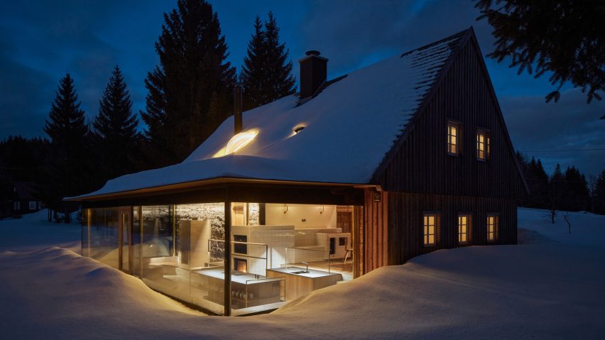 Photograph of cabin in snow