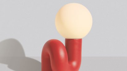 Red squiggly lamp on white backdrop