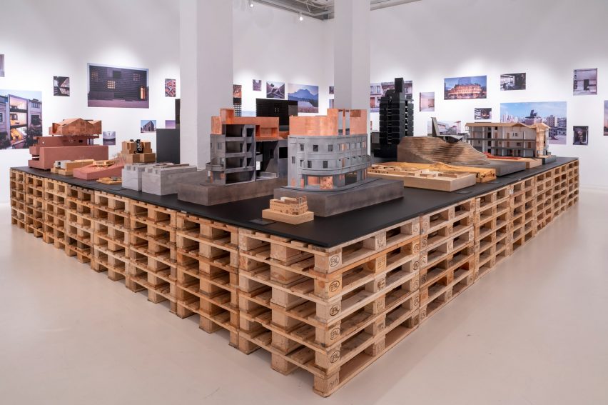 Architectural models on a table made of wooden pallets in Neri&Hu: Reflective Nostalgia exhibition