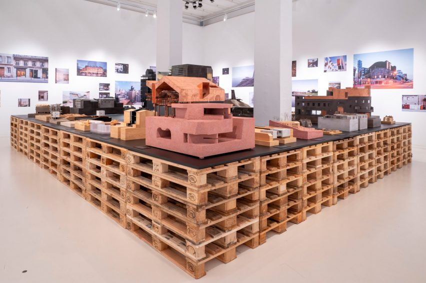 Architectural models on a table made of wooden pallets in Neri&Hu: Reflective Nostalgia exhibition