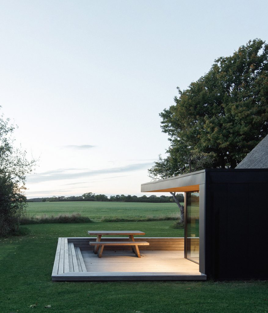 Sunken terrace of Nieby Crofters Cottage by Jan Henrik Jansen and Marshall Blecher