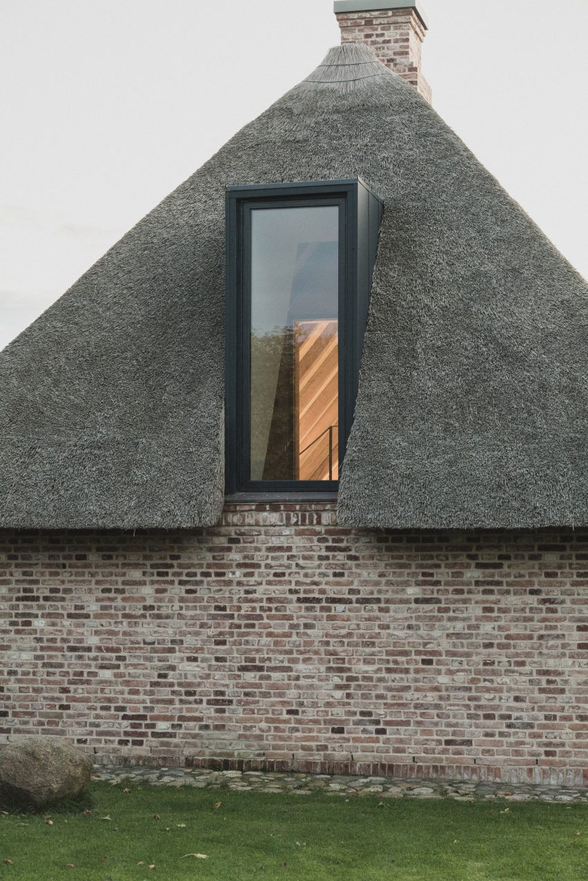 Thatched roof and dormer window in Nieby Crofters Cottage by Jan Henrik Jansen and Marshall Blecher