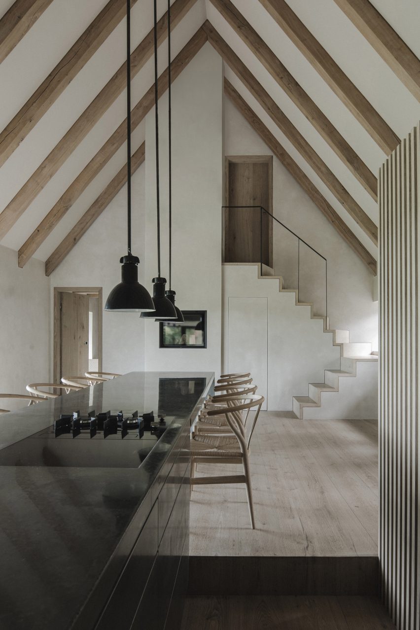 Dining table and staircase in Nieby Crofters Cottage by Jan Henrik Jansen and Marshall Blecher