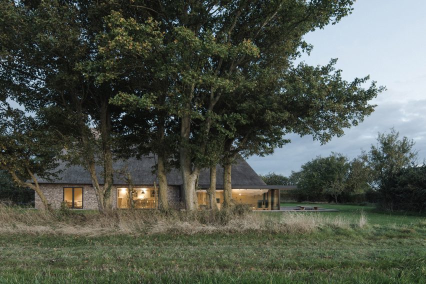 View of Nieby Crofters Cottage by Jan Henrik Jansen and Marshall Blecher through trees